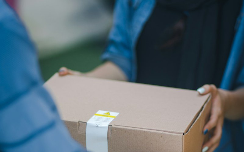 Warehouse operative handling packaged goods