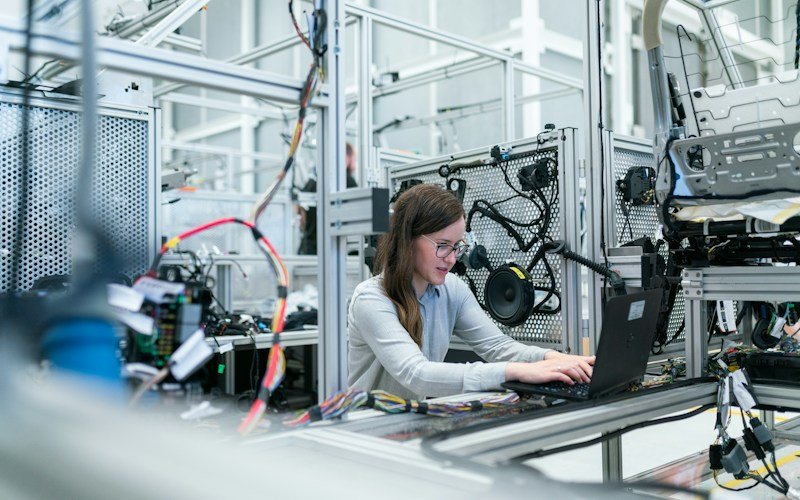 Worker supporting a modern factory production line